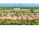 Aerial view showcasing home location near lake and surrounding community at 11625 Parrotfish St, Venice, FL 34292