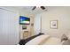 Cozy bedroom with TV, dresser, closet, and window providing plenty of natural light at 11625 Parrotfish St, Venice, FL 34292