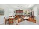 Bright clubhouse area with tile floors, ceiling fans, kitchenette and wooden tables with seating at 11625 Parrotfish St, Venice, FL 34292