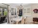 Charming dining room with plantation shutters allowing natural light, and access to the outdoor patio at 11625 Parrotfish St, Venice, FL 34292