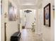 Inviting entryway with tile flooring, arched doorways, and stylish decor at 11625 Parrotfish St, Venice, FL 34292