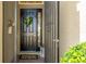 Close up of the home's front door, complete with a decorative wreath and lantern at 11625 Parrotfish St, Venice, FL 34292