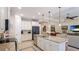 Spacious kitchen with an island, seamlessly connected to the living area, perfect for entertaining at 11625 Parrotfish St, Venice, FL 34292