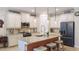 Modern kitchen with granite countertops, stainless steel appliances, and a breakfast bar at 11625 Parrotfish St, Venice, FL 34292