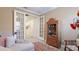 Relaxing seating area with french doors, display cabinet, and stylish decor at 11625 Parrotfish St, Venice, FL 34292