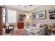 Relaxing living room with a comfortable sofa, stylish rug, and ample natural light at 11625 Parrotfish St, Venice, FL 34292