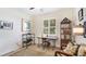 Well-lit office features a desk, shelving, a window, and stylish decor at 11625 Parrotfish St, Venice, FL 34292