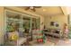 Inviting covered patio with comfortable seating, offering a cozy and stylish outdoor living space at 11625 Parrotfish St, Venice, FL 34292