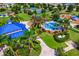 Aerial view of community park with splash pad, playground, tennis courts, and green spaces at 12031 Longview Lake Cir, Lakewood Ranch, FL 34211