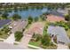 Aerial view of a neighborhood with waterfront homes with pools, lush landscaping, and stunning lake views at 12031 Longview Lake Cir, Lakewood Ranch, FL 34211