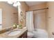 Well-lit bathroom with granite countertops, a modern sink, decorative mirrors, and a shower-tub combination at 12031 Longview Lake Cir, Lakewood Ranch, FL 34211