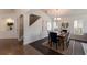 Elegant dining space with chandelier lighting, staircase, and view of windows, perfect for Gathering gatherings at 12031 Longview Lake Cir, Lakewood Ranch, FL 34211