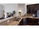 Stylish kitchen with granite countertops, dark wood cabinetry, stainless steel appliances, and open layout at 12031 Longview Lake Cir, Lakewood Ranch, FL 34211
