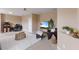 Inviting living space with modern decor, including a shag rug, plants, and furniture with neutral earth-tone colors at 12031 Longview Lake Cir, Lakewood Ranch, FL 34211