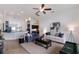 Open-concept living room with neutral decor, seamlessly connecting to other rooms at 12031 Longview Lake Cir, Lakewood Ranch, FL 34211