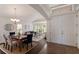 Inviting living room and dining area featuring hardwood floors, natural light, and a cozy atmosphere at 12031 Longview Lake Cir, Lakewood Ranch, FL 34211