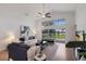 Bright living room with high ceilings, ceiling fan and view of outdoor area at 12031 Longview Lake Cir, Lakewood Ranch, FL 34211
