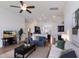 Open-concept living room with neutral decor, seamlessly connecting to other rooms at 12031 Longview Lake Cir, Lakewood Ranch, FL 34211