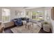 Cozy living room with a plush sofa, stylish decor, and bright windows offering natural light at 12031 Longview Lake Cir, Lakewood Ranch, FL 34211
