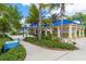 Inviting park pavilion with blue roof, perfect for gatherings and relaxation with lush landscaping around it at 12031 Longview Lake Cir, Lakewood Ranch, FL 34211