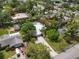 Aerial view of a house with lush greenery and a long driveway at 1207 71St Nw St, Bradenton, FL 34209
