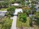 Aerial view of a home with a long driveway and mature trees at 1207 71St Nw St, Bradenton, FL 34209