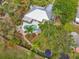 Aerial view of the property showcasing the pool, backyard, and lush landscaping at 1207 71St Nw St, Bradenton, FL 34209