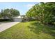 Charming single story home with a metal roof and mature, well-maintained landscaping at 1207 71St Nw St, Bradenton, FL 34209