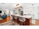 Open layout featuring island with cooktop and breakfast bar, seamlessly connecting living spaces at 1207 71St Nw St, Bradenton, FL 34209