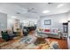 Open concept living room with hardwood floors, skylight, and a seamless transition to the kitchen at 1207 71St Nw St, Bradenton, FL 34209