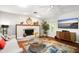 Cozy living room featuring a fireplace, stylish decor, and plenty of natural light at 1207 71St Nw St, Bradenton, FL 34209