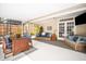 Spacious patio area featuring comfortable seating and a wooden dining table perfect for gatherings and outdoor entertaining at 1207 71St Nw St, Bradenton, FL 34209