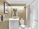 Clean bathroom features a vanity, toilet, and shower-tub combo, maximizing space and functionality at 1233 N Gulfstream Ave # 401, Sarasota, FL 34236