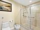 Bathroom featuring a glass-enclosed shower with tiled walls and a bidet at 1233 N Gulfstream Ave # 401, Sarasota, FL 34236