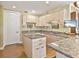 Beautiful and open kitchen area with an island, modern appliances, and hardwood flooring at 1233 N Gulfstream Ave # 401, Sarasota, FL 34236