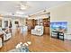 Spacious living room boasts hardwood floors, built in shelves, and modern decor at 1233 N Gulfstream Ave # 401, Sarasota, FL 34236