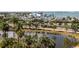 Scenic waterfront view featuring a marina, lush greenery, and a bustling city street with palm trees at 1233 N Gulfstream Ave # 401, Sarasota, FL 34236