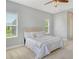 Comfortable bedroom with natural light and a view of the greenery outside at 12331 Halfmoon Lake Ter, Bradenton, FL 34211