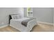 Bedroom with neutral colors and comfortable carpeting; a peaceful and serene retreat at 12331 Halfmoon Lake Ter, Bradenton, FL 34211