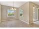 Cozy dining area with natural light and sliding door access to outdoor space at 12331 Halfmoon Lake Ter, Bradenton, FL 34211
