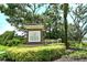 Community entrance sign for Eagle Trace, surrounded by landscaping and mature trees at 12331 Halfmoon Lake Ter, Bradenton, FL 34211