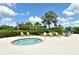 Inviting hot tub surrounded by lush landscaping, providing a serene and private outdoor space at 12331 Halfmoon Lake Ter, Bradenton, FL 34211
