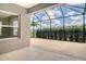 Screened lanai showcasing the beautiful and private backyard at 12331 Halfmoon Lake Ter, Bradenton, FL 34211