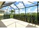 Spacious screened patio offering outdoor living with views of the landscaped backyard at 12331 Halfmoon Lake Ter, Bradenton, FL 34211