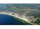 Panoramic aerial view showcasing the community's prime beachfront location with stunning coastal views and surrounding cityscape at 1350 N Portofino Dr # 402, Sarasota, FL 34242