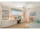 Bedroom with built-in shelving and drawers, perfect for a home office setup at 1350 N Portofino Dr # 402, Sarasota, FL 34242