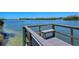 Waterfront dock area featuring seating and direct access to beautiful bay waters and idyllic views at 1350 N Portofino Dr # 402, Sarasota, FL 34242