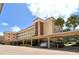 Beautiful condo complex featuring covered parking, tropical landscaping, and stunning architectural details at 1350 N Portofino Dr # 402, Sarasota, FL 34242