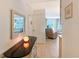 Inviting hallway showcasing neutral tones, tasteful decor, and seamless flow into the living area with tiled floor at 1350 N Portofino Dr # 402, Sarasota, FL 34242