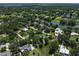 Picturesque aerial shot highlights the home's location near scenic ponds and tree-lined streets at 13514 4Th E Plz, Bradenton, FL 34212